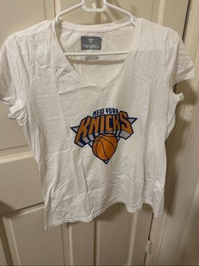 Fanatics White V-Neck Knicks Logo Tee with Orange & Blue Graphic